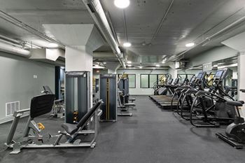 Fitness center with cardio and strength training equipment 3